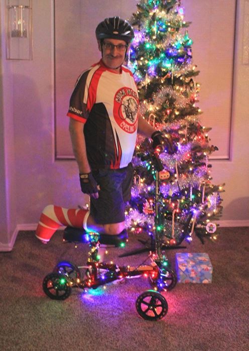man on Christmas knee scooter